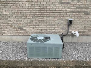 air conditioning unit hooked up to the outside of a building